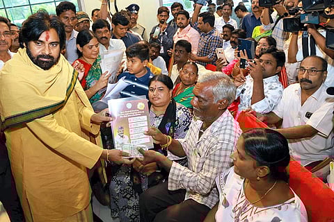 Pawan Kalyan distributes pension during an event